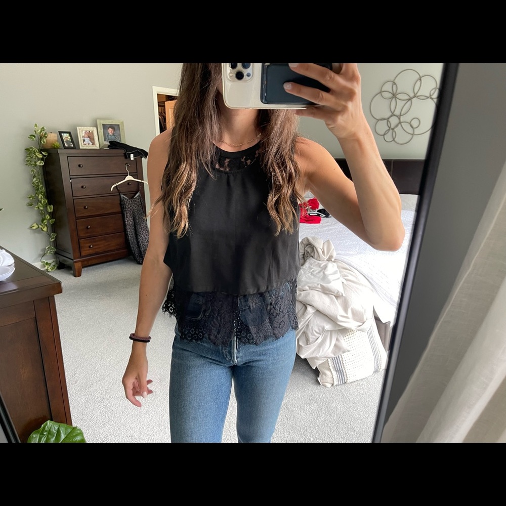 Black tank with lace underlay.